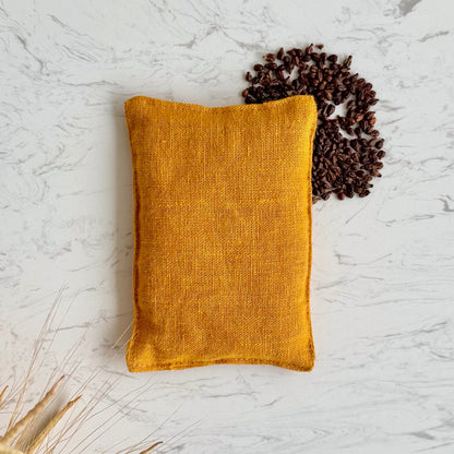 Handwaermekissen aus Leinen in Kurkuma farben